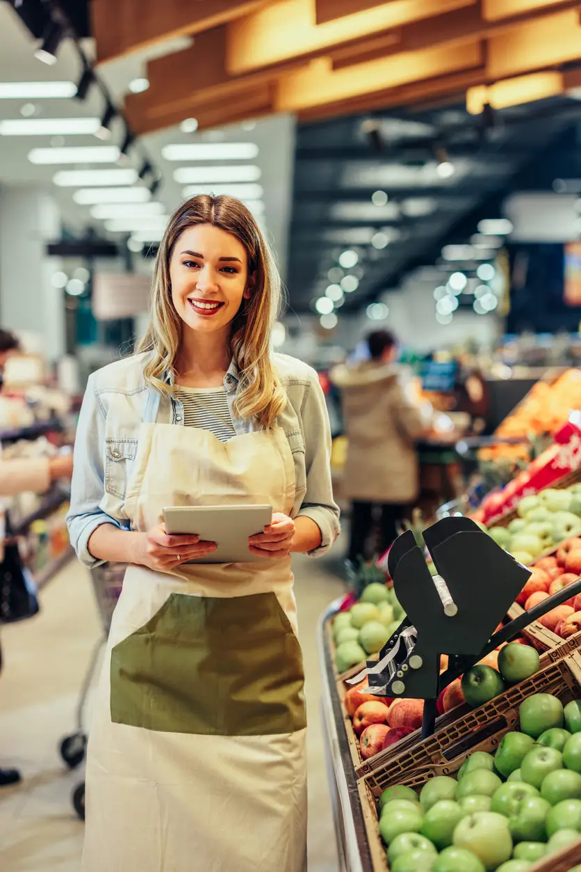 Business owner managing inventory, emphasizing the importance of commercial insurance for businesses