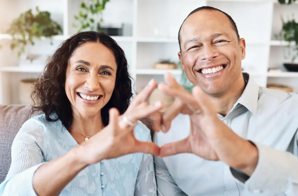 Couple celebrating new living space, showcasing importance of protecting personal property and peace of mind