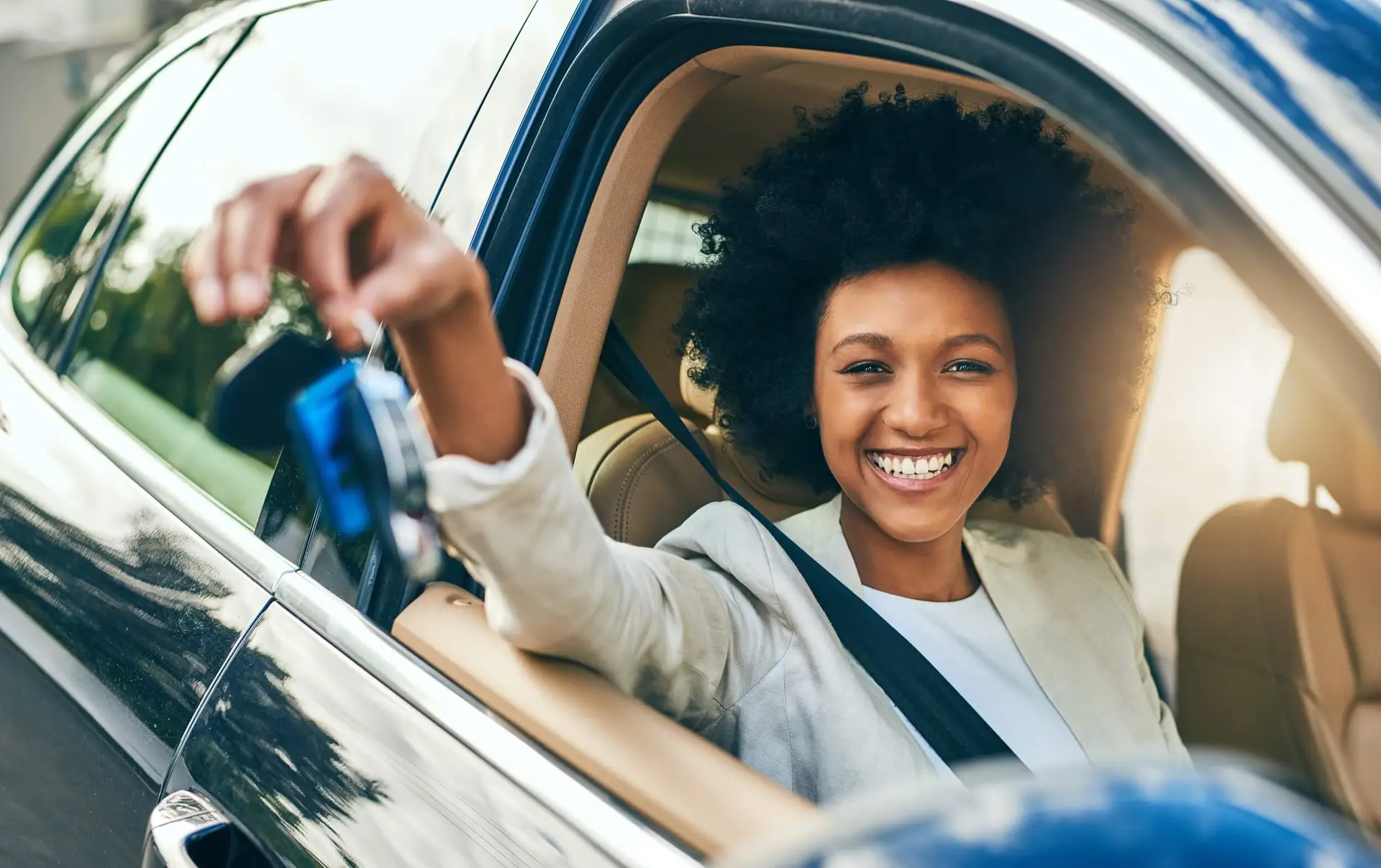 would you like to drive happy woman showing off new car purchase