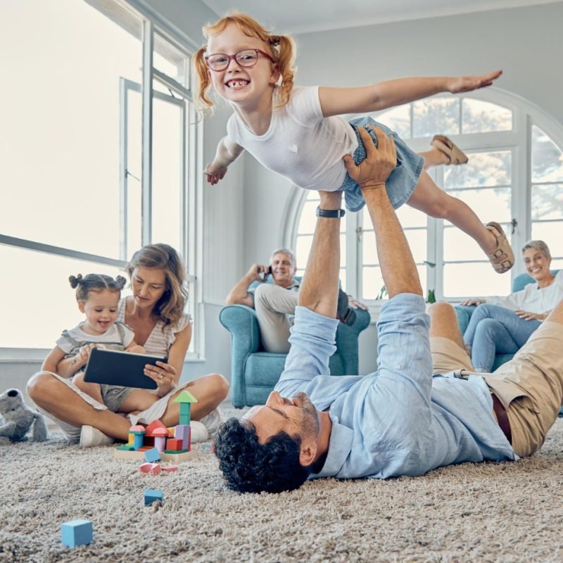 Loving family spending quality time at home, safeguarded under renters insurance coverage.